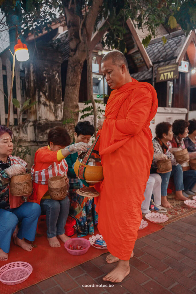 Monks Giving alms during the Tak Bat Ceremony