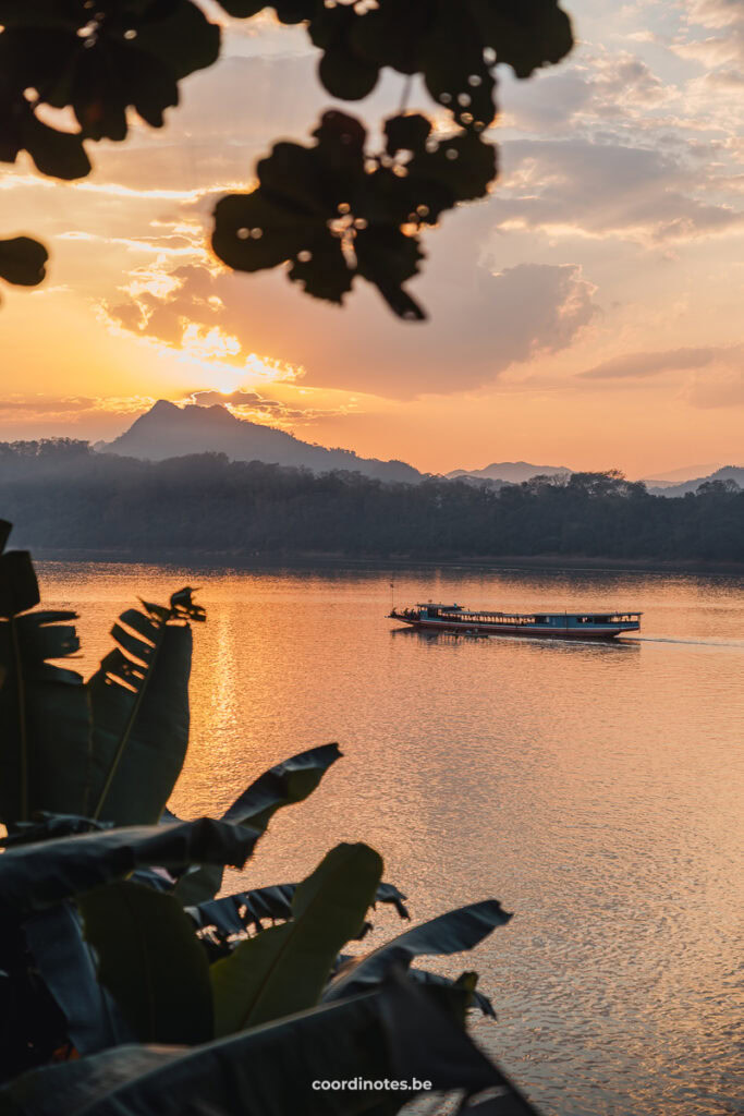 A beautiful orange sunset at the Mekong river in Luang Prabang