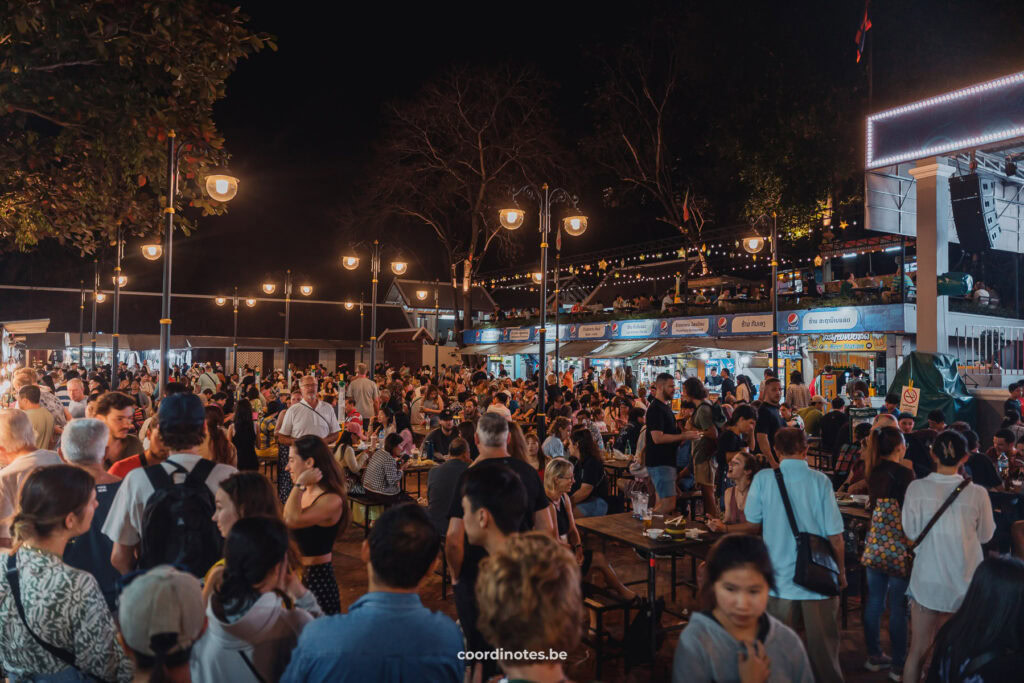 A lot of people at the tables of the night and Streetfood market in Luang Prabang