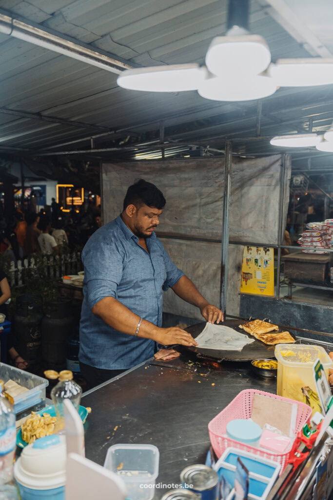 A vendor making a Roti, a typical pancake like snack in Asia, at the Night and Streetfood market in Luang Prabang