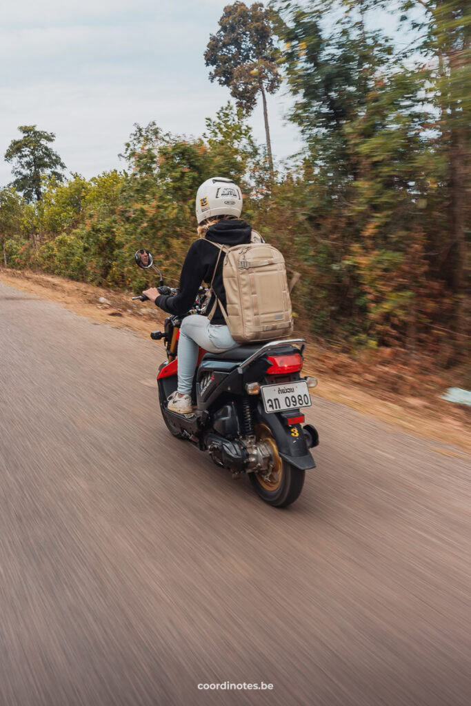 Sarah on a motorbike driving the Thakhek Loop