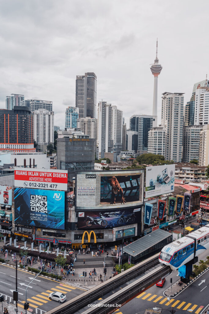 Skyscrapers, billboards and a sky train in front in Kuala Lumpur.