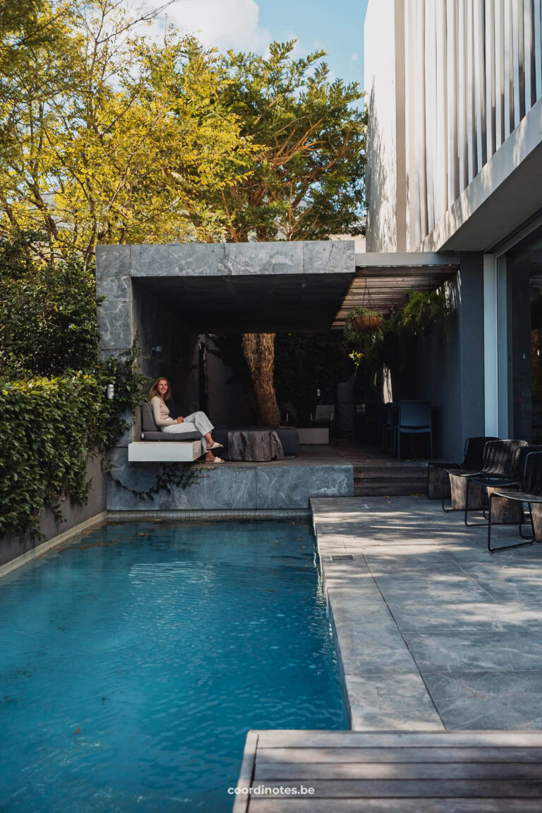 Sarah sitting in the terrace lounge behind the pool at the POD Camps Bay hotel