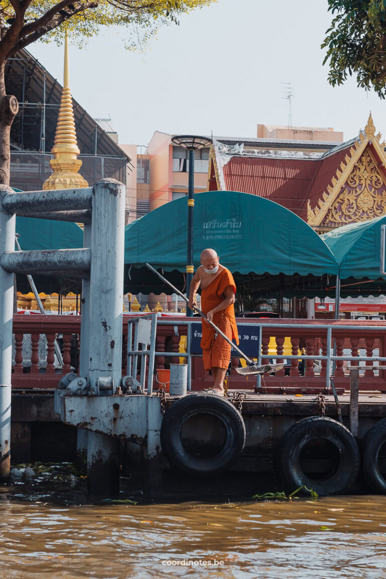 A monk on the shore during the boat trip in bangkok