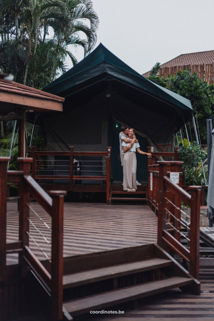 The two of us standing in on the stairs in front of our glamping tent in Luxury tented village in St Lucia